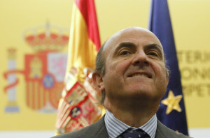 Spain's Economy Minister de Guindos gestures during the swearing-in ceremony of his economic team at the Economy Ministry in Madrid