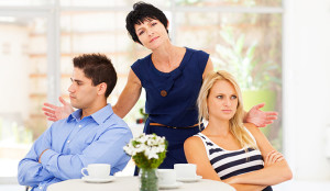 mother feeling helpless caught in between young couple fighting