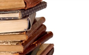 Stack of vintage books isolated on white