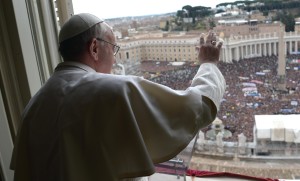 Newly elected Pope Francis appears at the window of his future private apartment to bless faithful during Angelus prayer at Vatican